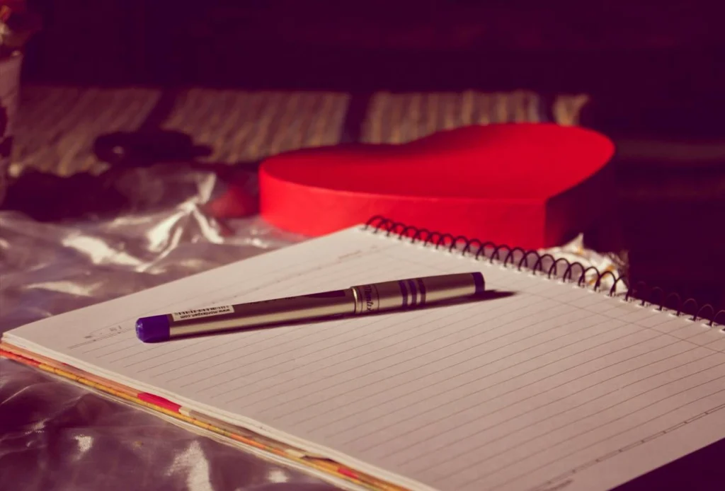 Notebook and pen for dialogue writing and formatting